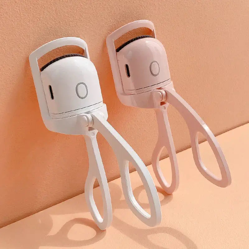 Enhance your lashes with the Heated Eyelash Curler for a professional look. Beautycom.